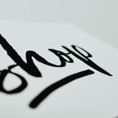 Close-up of a handwritten sign promoting support for small businesses.